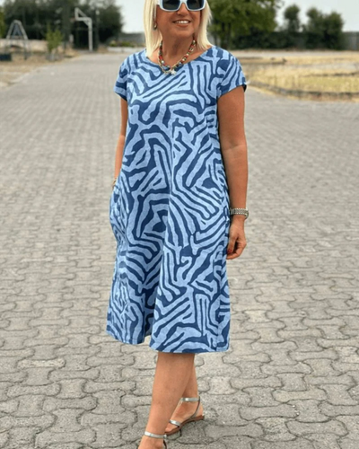 Abito Estivo Lungo Safari Chic con Stampa Zebra e Tasche Laterali